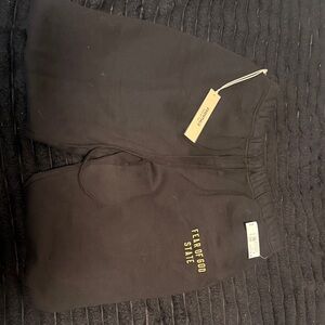 Fear of God Black Joggers with Gold Text